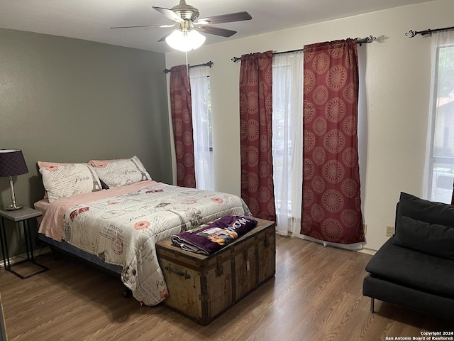 bedroom featuring wood-type flooring and ceiling fan