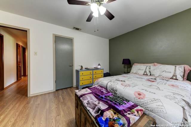 bedroom featuring ceiling fan and light hardwood / wood-style floors