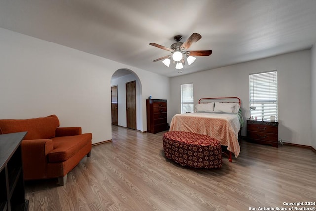 bedroom featuring light hardwood / wood-style floors and ceiling fan