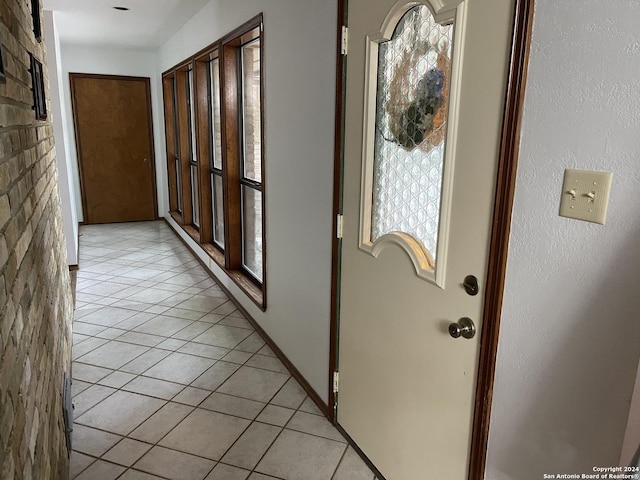 hallway featuring light tile patterned floors