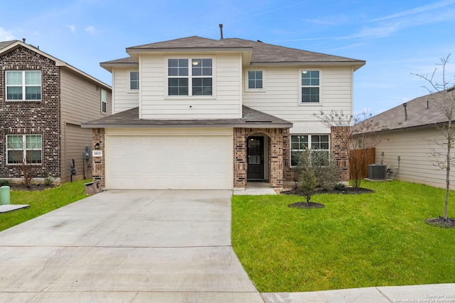 view of front of home with a garage, a front lawn, and central air condition unit