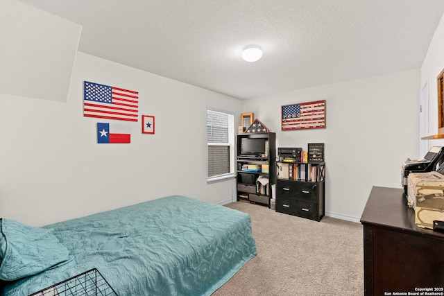 carpeted bedroom featuring a textured ceiling