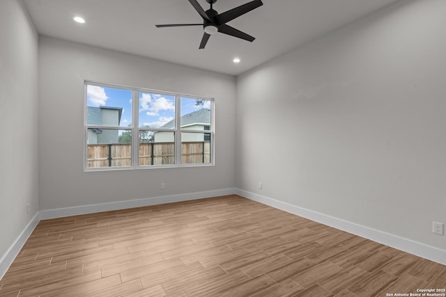 unfurnished room featuring ceiling fan and light wood-type flooring