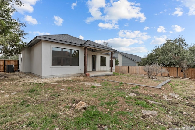 back of property with a patio and cooling unit