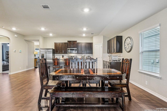 dining area with dark wood-type flooring