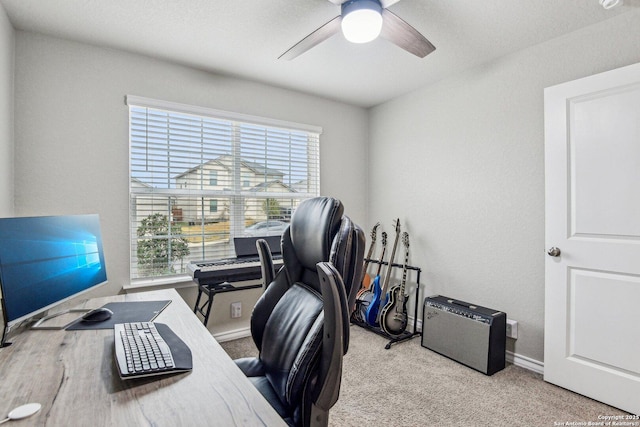 carpeted home office with ceiling fan