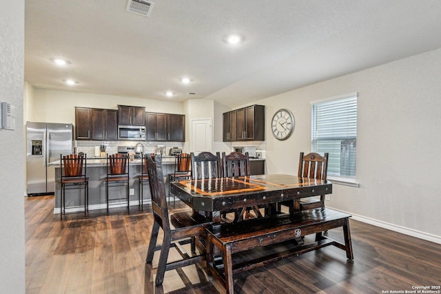 dining room featuring dark hardwood / wood-style flooring