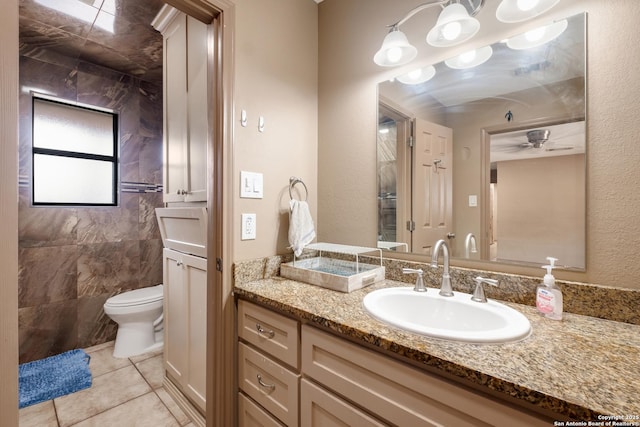 bathroom with tile patterned floors, vanity, and toilet