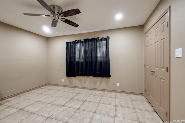 spare room with ceiling fan