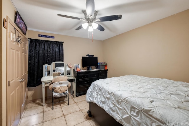 bedroom featuring light tile patterned floors and ceiling fan