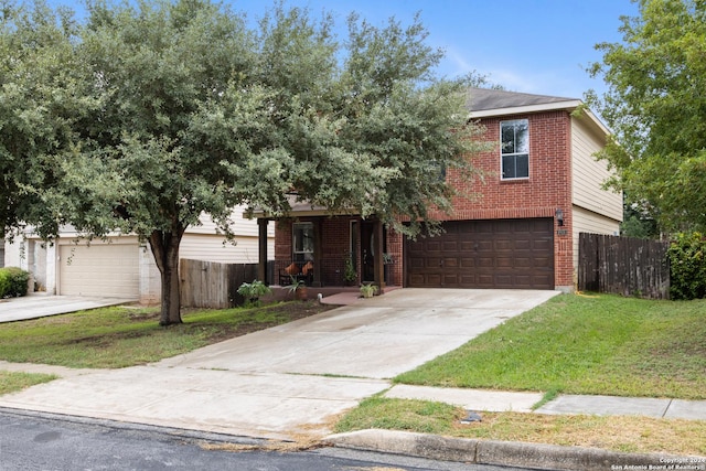 obstructed view of property with a garage and a front yard