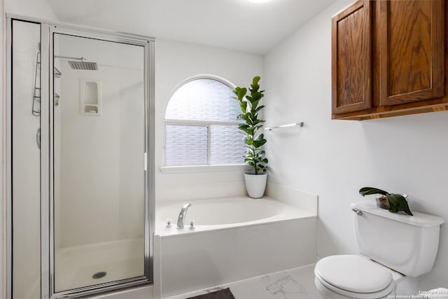 bathroom featuring toilet and independent shower and bath