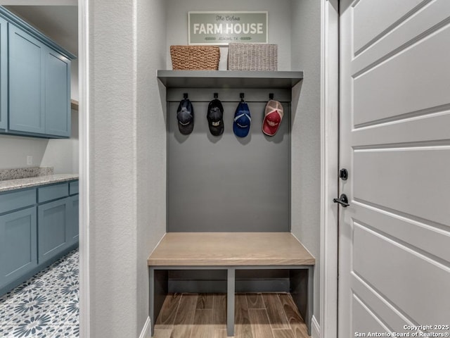 mudroom with light hardwood / wood-style flooring