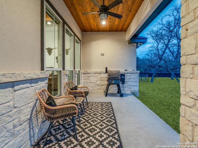 view of patio with a grill and ceiling fan