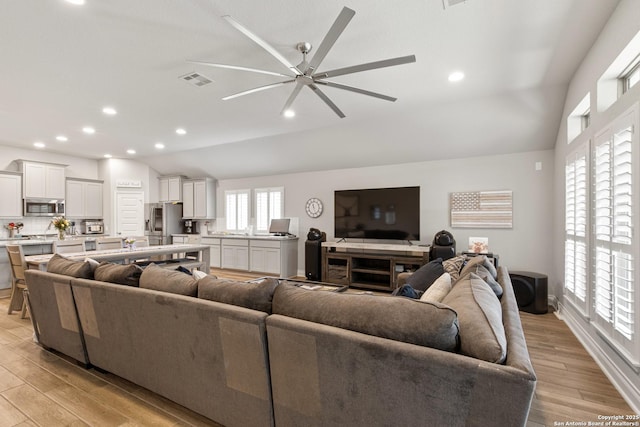 1905 High Bank, Seguin, TX 78155 - living room with light wood-style floors, a ceiling fan, lofted ceiling, recessed lighting, and baseboards