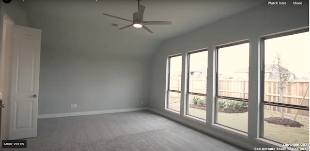 empty room featuring ceiling fan, lofted ceiling, and wood-type flooring