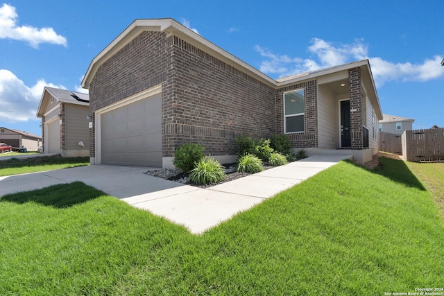 view of front facade featuring a garage and a front lawn