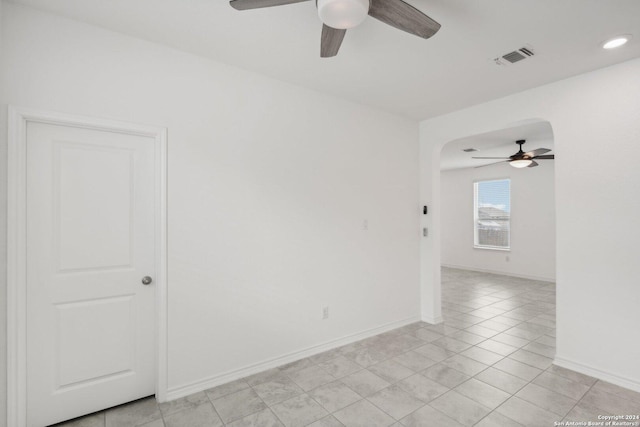 unfurnished room with ceiling fan