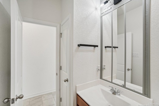 bathroom featuring vanity and tile patterned flooring