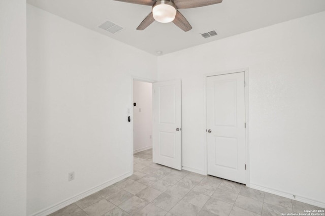 unfurnished bedroom featuring ceiling fan