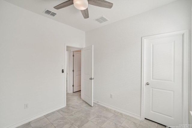 unfurnished bedroom featuring ceiling fan