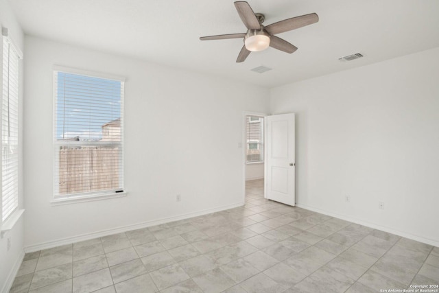 spare room with ceiling fan