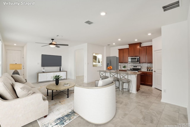 living room with ceiling fan