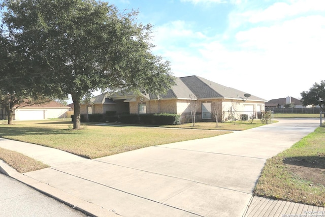 ranch-style house featuring a residential view, driveway, a front lawn, and fence