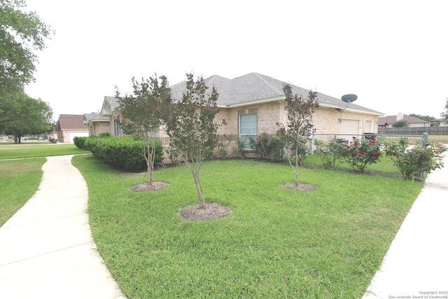 view of front of home with an attached garage and stone siding