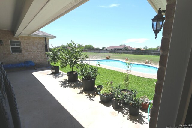 view of pool featuring a patio