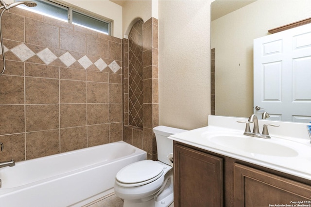 full bathroom with tiled shower / bath combo, vanity, and toilet