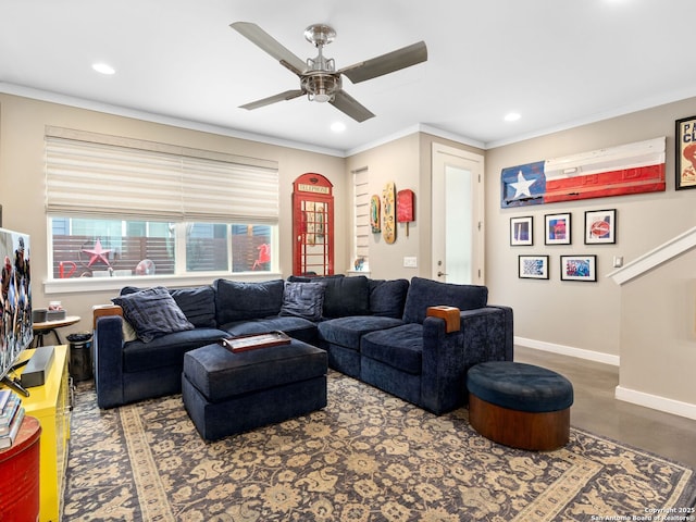 living room featuring crown molding and ceiling fan