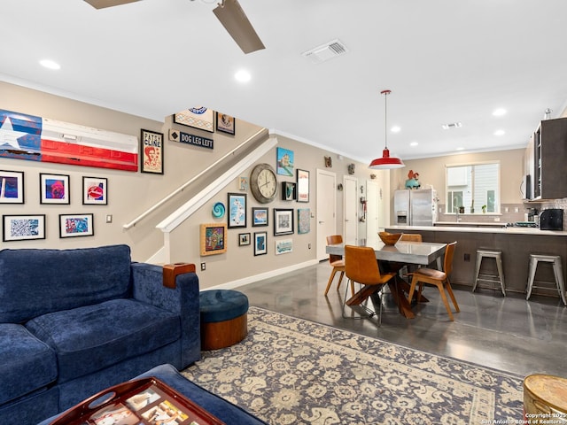 living room featuring crown molding