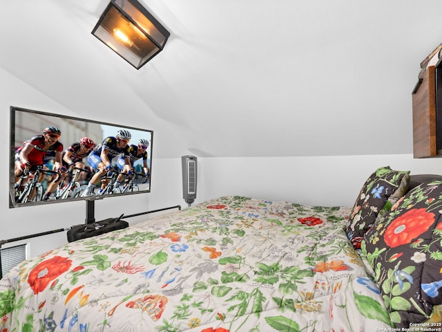 bedroom featuring vaulted ceiling