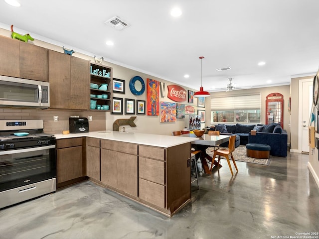 kitchen with decorative light fixtures, tasteful backsplash, ceiling fan, kitchen peninsula, and stainless steel appliances