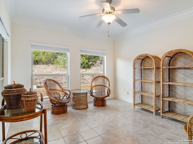 sitting room featuring crown molding, light tile patterned floors, and ceiling fan