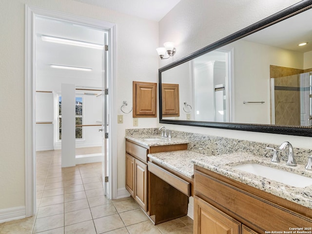 bathroom with vanity, tile patterned floors, and a shower with door