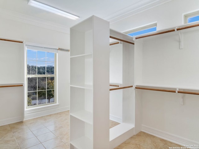 walk in closet featuring light tile patterned floors