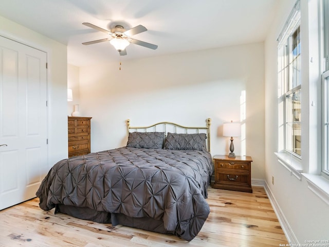 bedroom featuring ceiling fan and light hardwood / wood-style flooring