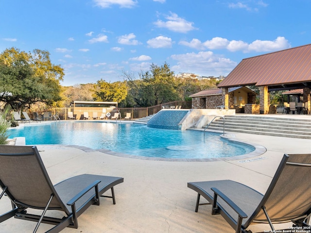 view of swimming pool with a patio