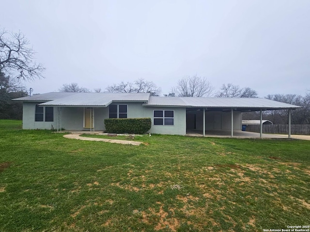 back of house featuring a lawn