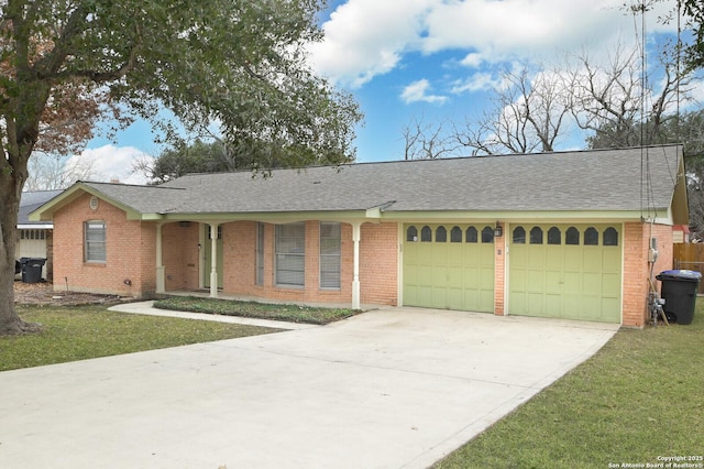 ranch-style home featuring a garage and a front yard