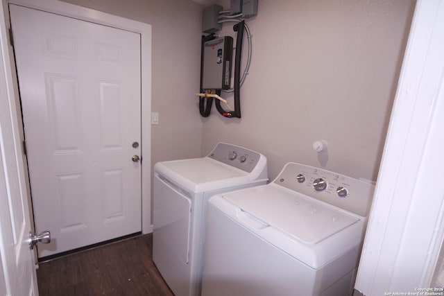 laundry area with dark wood-type flooring and washing machine and clothes dryer