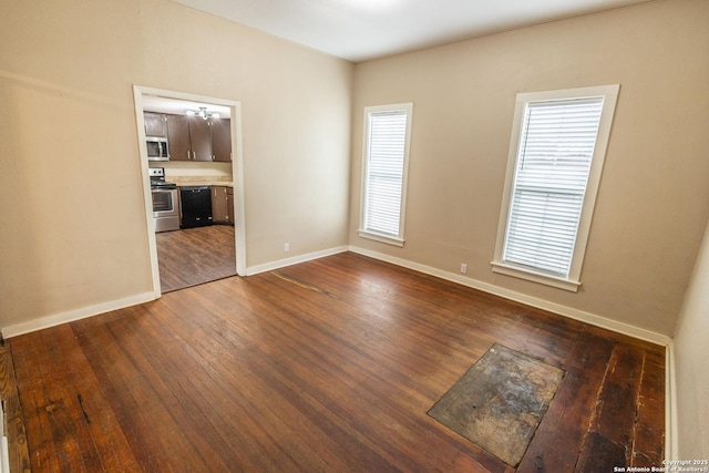 unfurnished room featuring dark wood-type flooring