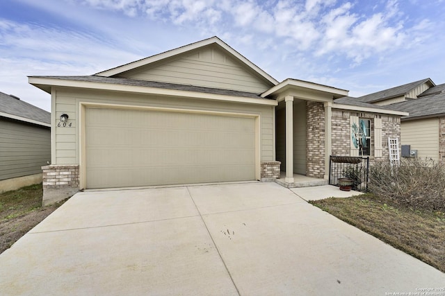 ranch-style home featuring a garage