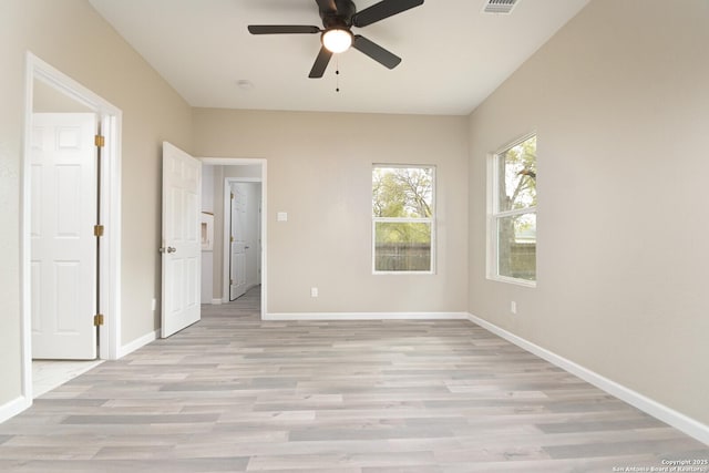 spare room featuring ceiling fan and light wood-type flooring