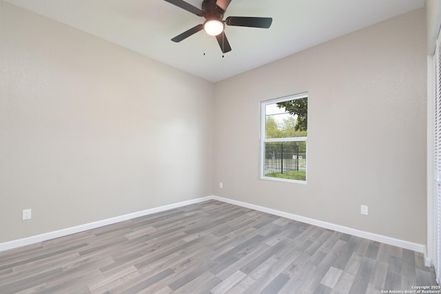 empty room featuring ceiling fan and light wood-type flooring