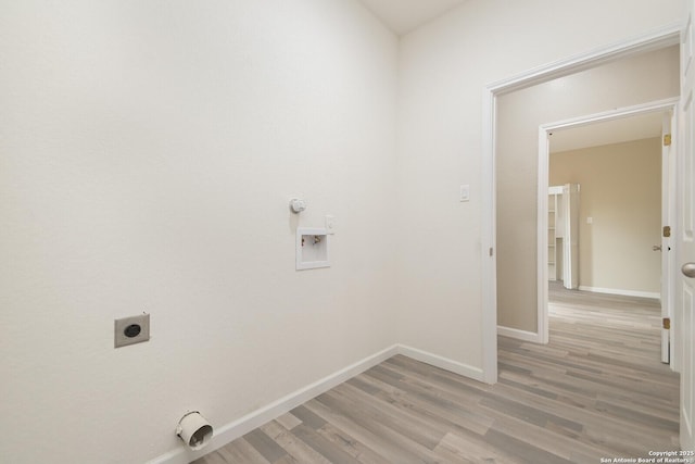 laundry room featuring washer hookup, hookup for a gas dryer, hookup for an electric dryer, and light wood-type flooring