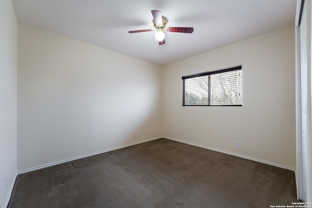 unfurnished room featuring dark colored carpet and ceiling fan