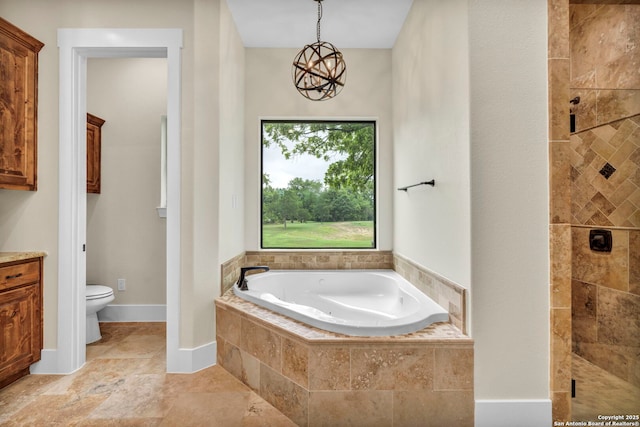 bathroom featuring toilet, separate shower and tub, and a notable chandelier